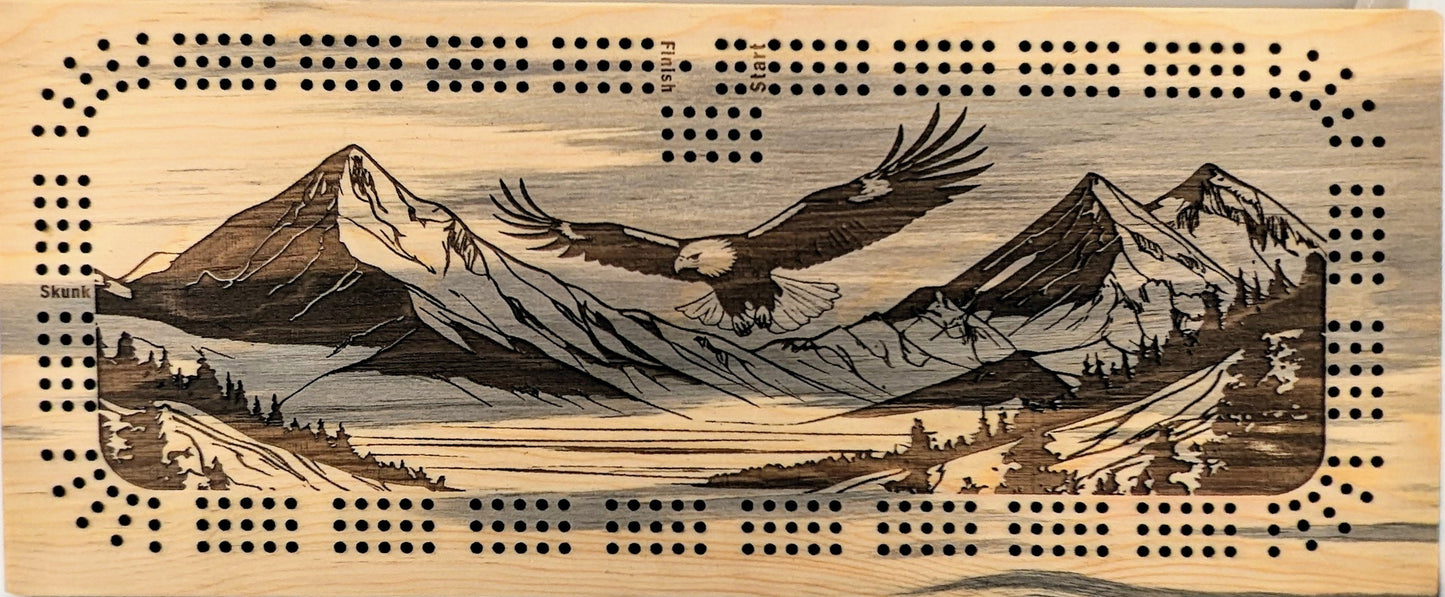 Bald Eagle flying over a valley with mountains, 3 Track Cribbage Board - Laser engraved